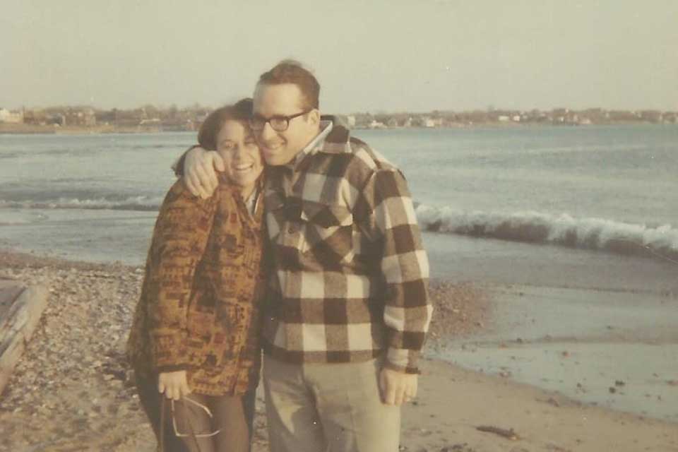Ron Kronish and wife Amy in coats on the beach in 1968