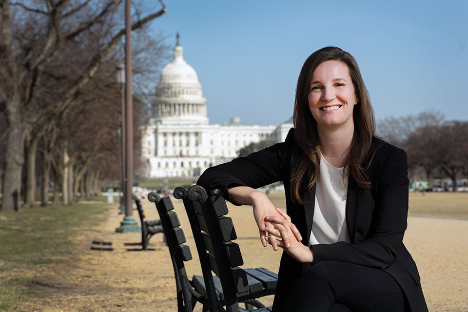 Lily Adams seated in front of the Capitol in Washington, DC