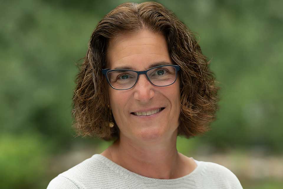 Rachel Meyers pictured outside with greenery in the background