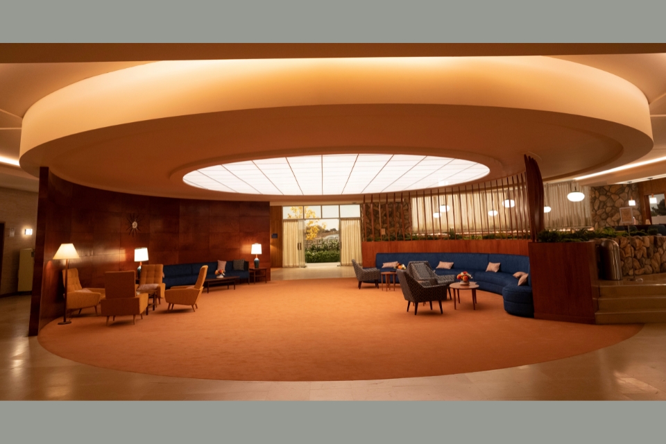 A room at the Vista Motor Lodge in the Apple+ series Hello Tomorrow combines a 1950s aesthetic with futuristic elements, such as a large domed light fixture.