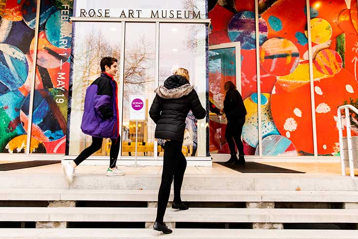 Visitors entering the front doors of the Rose Art Museum