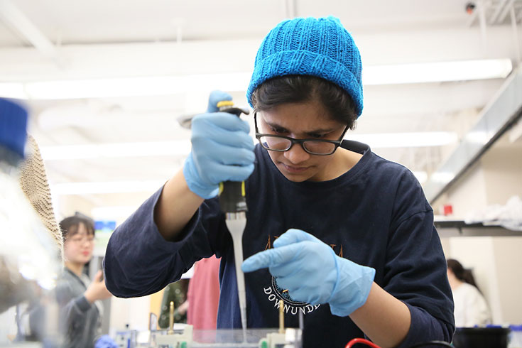 Female student in science lab