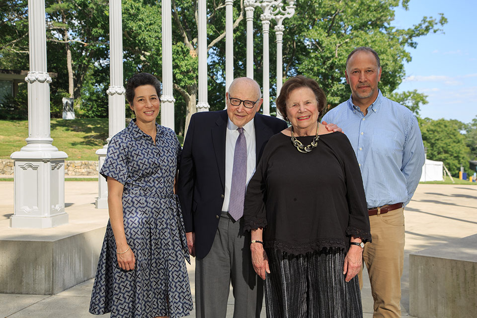 Alumni Parents Joanna Fung and Matthew Ginsburg with Ginsburg grandparents, outside on Brandeis campus.