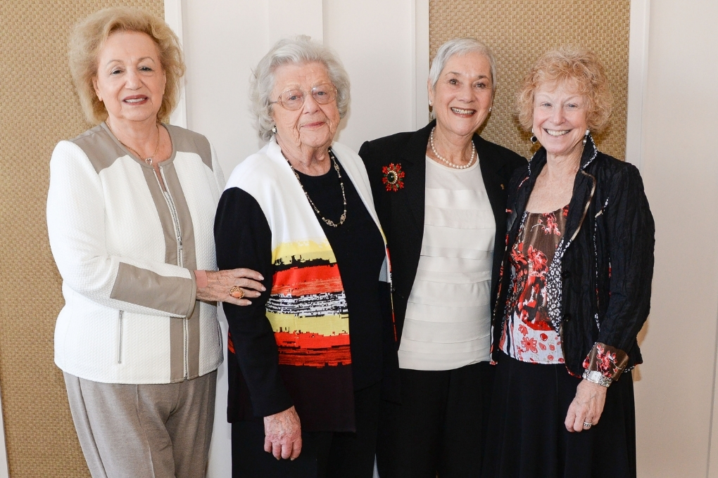 four women smiling